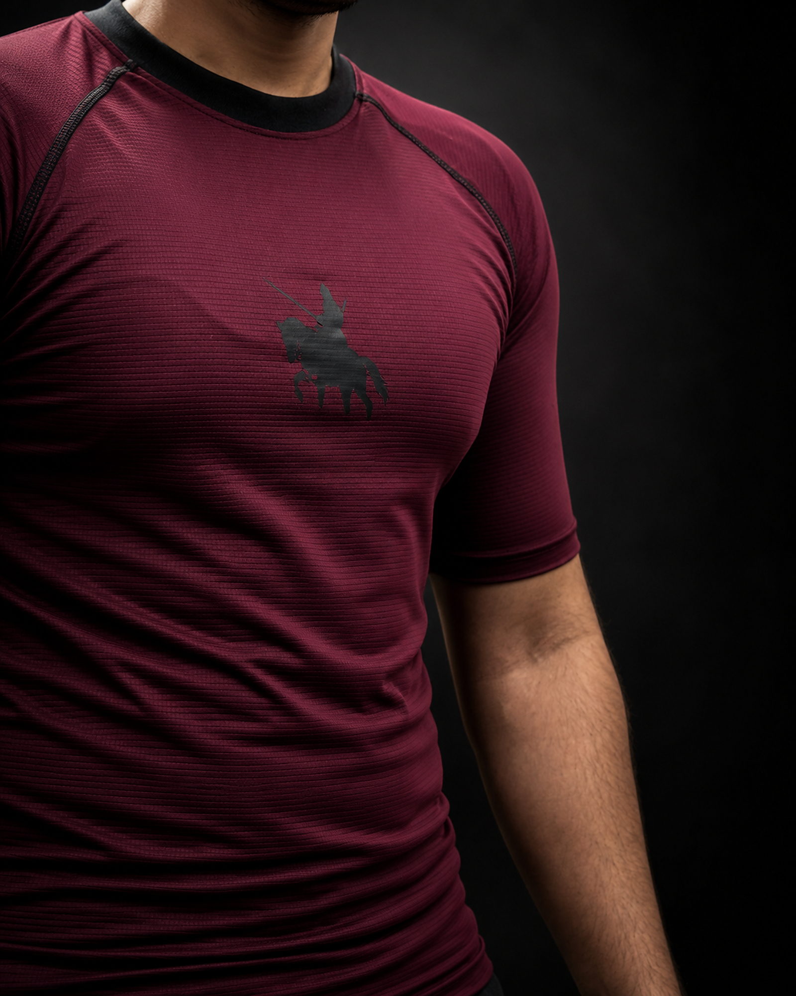 The Shield — Maroon · Knight insignia detail